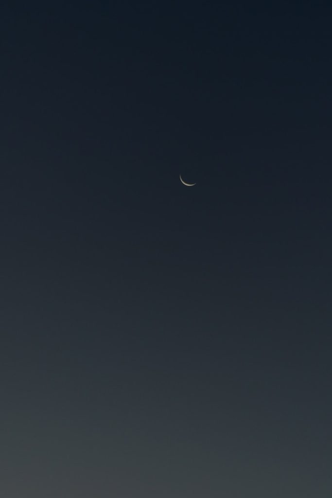 Crescent moon in a dark sky